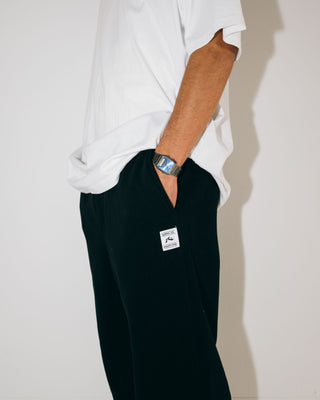 Man wearing Core Division Trackpant in Black