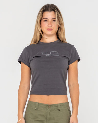 Woman wearing Rusty Essentials Skimmer Baby Tee in Grey