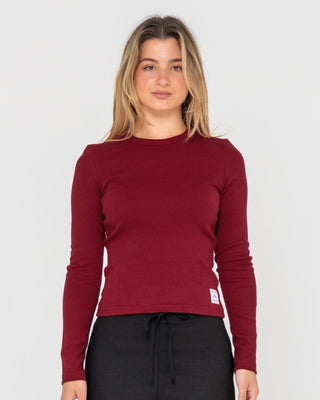 Woman wearing Rusty Essentials Ribbed Long Sleeve Tee in Rhubarb