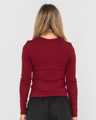 Woman wearing Rusty Essentials Ribbed Long Sleeve Tee in Rhubarb