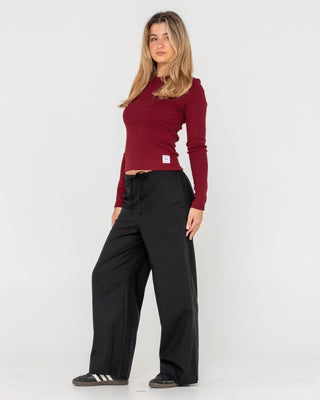 Woman wearing Rusty Essentials Ribbed Long Sleeve Tee in Rhubarb