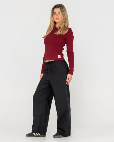 Woman wearing Rusty Essentials Ribbed Long Sleeve Tee in Brown