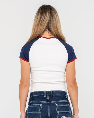 Woman wearing Mr Worldwide Raglan Skimmer Tee in White