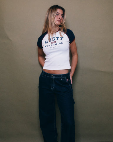 Woman wearing Mr Worldwide Raglan Skimmer Tee in White