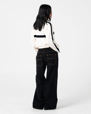 Woman wearing White Lines Long Sleeve Crew Neck Knit in Cream / Black