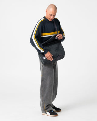 Man wearing White Lines 2.0 Knitted Crew in Steel Blue