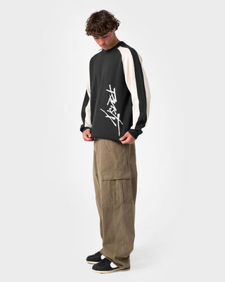 Man wearing Roll Safe Boxy Knitted Crew in Black Marle