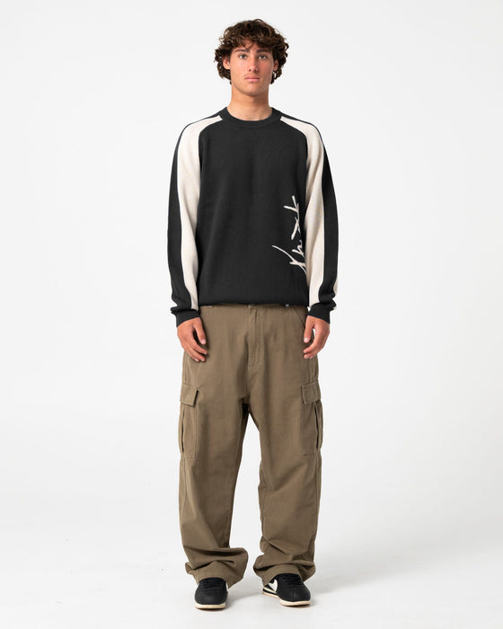 man-wearing-roll-safe-boxy-knitted-crew-in-black-marle