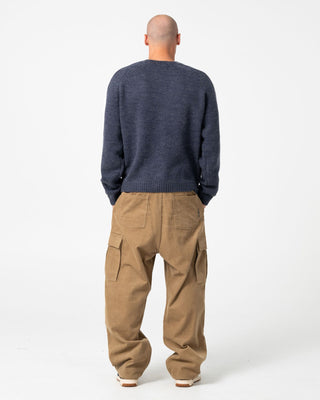 Man wearing Sea Captain Boxy Knitted Crew in Navy Blue