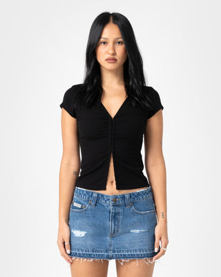 Woman wearing Im Hooked Cap Sleeve Fashion Top in Black