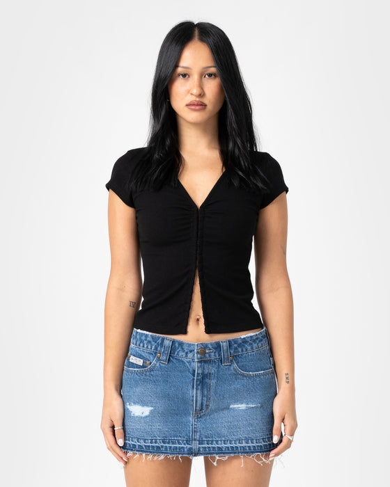 woman-wearing-im-hooked-cap-sleeve-fashion-top-in-black