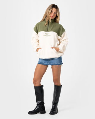 Woman wearing Central Division Crew Polar Fleece in Khaki / Cream