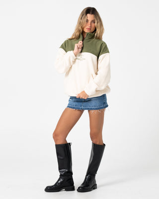 Woman wearing Central Division Crew Polar Fleece in Khaki / Cream