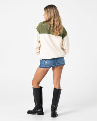 Woman wearing Central Division Crew Polar Fleece in Khaki / Cream