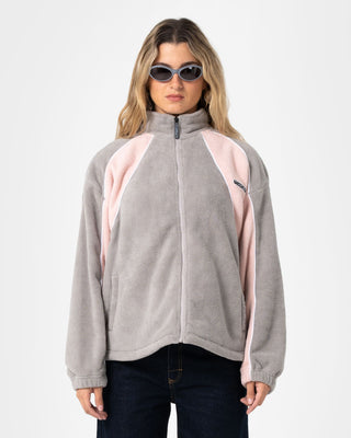 Woman wearing Two Tides Zip Through Sherpa Fleece in Pink A Boo / Grey
