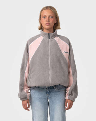 Woman wearing Two Tides Zip Through Sherpa Fleece in Pink A Boo / Grey