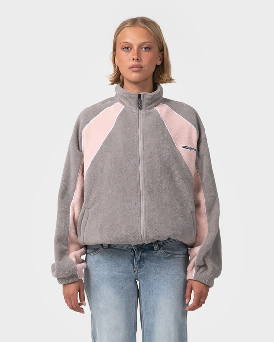 woman-wearing-two-tides-zip-through-sherpa-fleece-in-pink-a-boo-grey