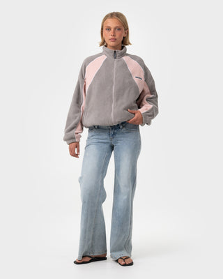 Woman wearing Two Tides Zip Through Sherpa Fleece in Pink A Boo / Grey