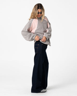 Woman wearing Two Tides Zip Through Sherpa Fleece in Pink A Boo / Grey