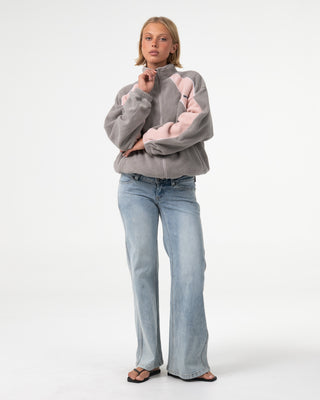 Woman wearing Two Tides Zip Through Sherpa Fleece in Pink A Boo / Grey