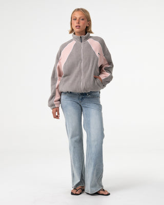 Woman wearing Two Tides Zip Through Sherpa Fleece in Pink A Boo / Grey