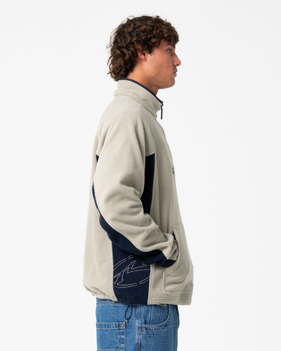 man-wearing-blizzard-quarter-zip-polar-fleece-in-abbey-stone