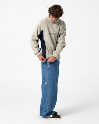 Man wearing Blizzard Quarter Zip Polar Fleece in Abbey Stone