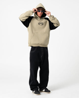 Man wearing Shesh Besh Hooded Fleece in Abbey Stone