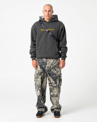 Man wearing Outliner Hooded Fleece in Carbon