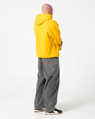 Man wearing Rusteeze Hooded Fleece in Gold Fusion