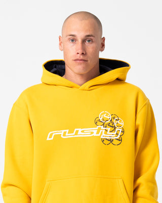 Man wearing Rusteeze Hooded Fleece in Gold Fusion