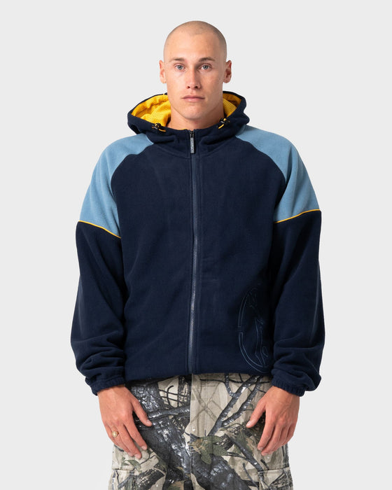 man-wearing-tectonic-hooded-zip-thru-polar-fleece-in-navy-blue