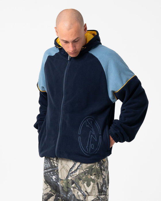 man-wearing-tectonic-hooded-zip-thru-polar-fleece-in-navy-blue