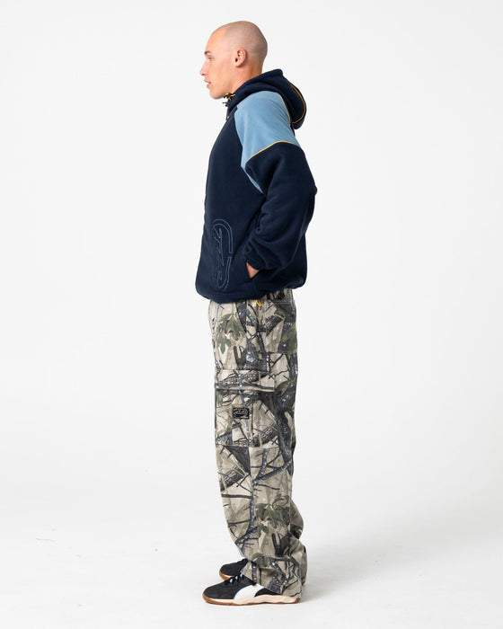 man-wearing-tectonic-hooded-zip-thru-polar-fleece-in-navy-blue