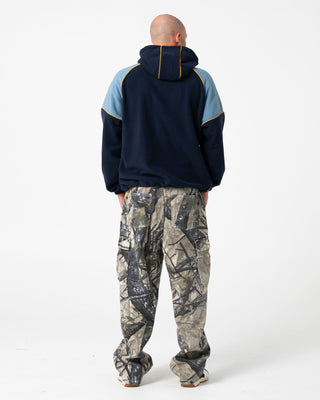 Man wearing Tectonic Hooded Zip Thru Polar Fleece in Navy Blue