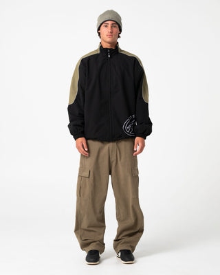 Man wearing Frontline Track Jacket in Black
