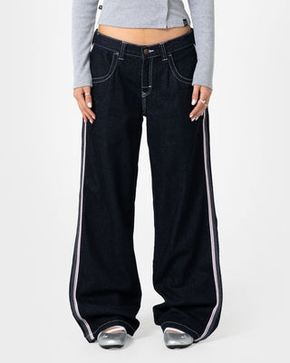 Woman wearing Flip Mommy Low Rise Wide Leg Denim Jean in Raw Dawg / Pink