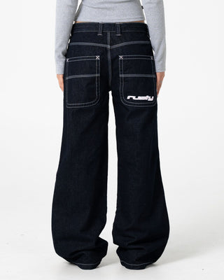 Woman wearing Flip Mommy Low Rise Wide Leg Denim Jean in Raw Dawg / Pink