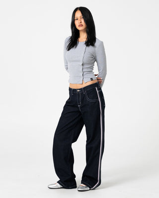 Woman wearing Flip Mommy Low Rise Wide Leg Denim Jean in Raw Dawg / Pink