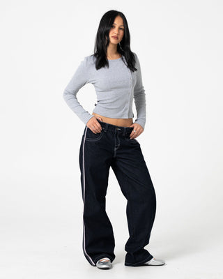 Woman wearing Flip Mommy Low Rise Wide Leg Denim Jean in Raw Dawg / Pink