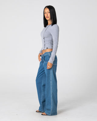 Woman wearing Flip Mommy Low Rise Tapeless Denim Jean in Authentic Blue