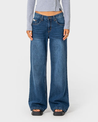 Woman wearing Lucy Loose Low Rise Jean in Blasted Deep Sea Blue