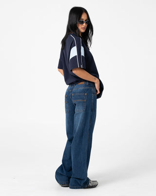 Woman wearing Lucy Loose Low Rise Jean in Blasted Deep Sea Blue