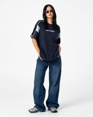 Woman wearing Lucy Loose Low Rise Jean in Blasted Deep Sea Blue