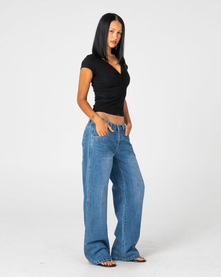 Woman wearing Wendy Wide Low Rise Denim Jean in Blasted Middy Blue