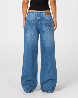 Woman wearing Wendy Wide Low Rise Denim Jean in Blasted Middy Blue