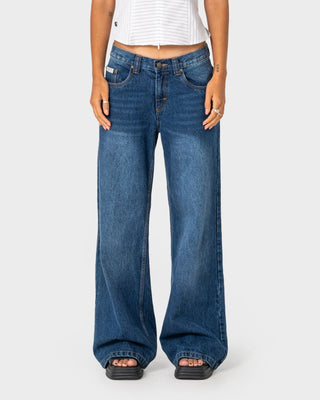 Woman wearing Wendy Wide Low Rise Denim Jean in Blasted Deep Sea Blue