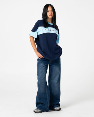 Woman wearing Wendy Wide Low Rise Denim Jean in Blasted Deep Sea Blue