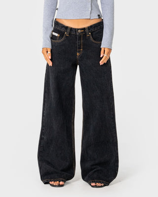 Woman wearing Wendy Wide Low Rise Denim Jean in Black Out