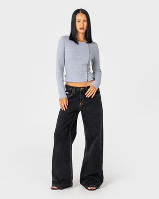 woman-wearing-wendy-wide-low-rise-denim-jean-in-black-out